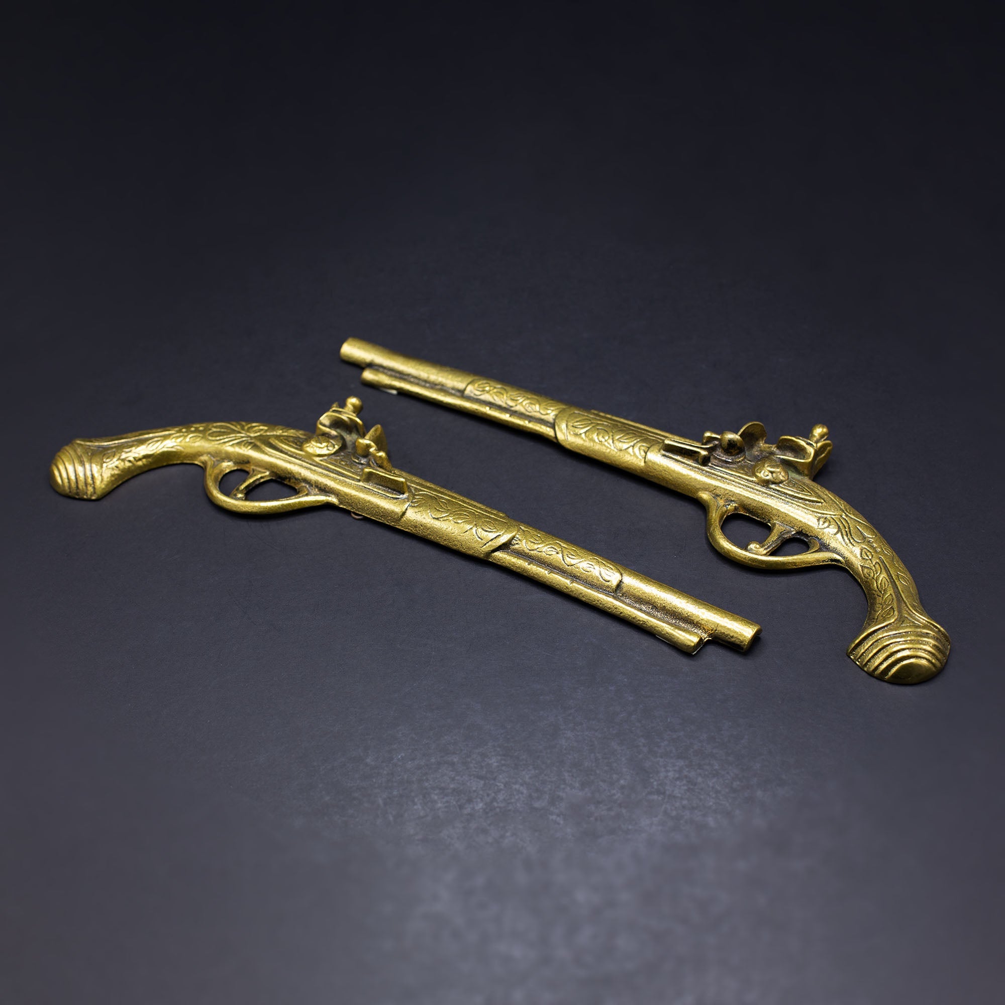 A Glorious Pair Of Brass Pistols - FLORA BLACK
